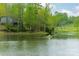 Scenic view of person kayaking on a tranquil pond surrounded by lush greenery at 807 And 809 Sparrow Springs Rd, Kings Mountain, NC 28086