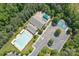 Overhead view of community amenities including pool, tennis court, covered picnic area, parking, and landscaping at 878 Treasure Ct, Fort Mill, SC 29708