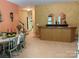 View of the bar area in the home with decorative accents and adjacent dining space at 878 Treasure Ct, Fort Mill, SC 29708