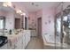Inviting bathroom features a soaking tub, double vanity, and soft pink walls at 878 Treasure Ct, Fort Mill, SC 29708
