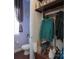 Hallway bathroom and coat rack area in a home with wood floors at 878 Treasure Ct, Fort Mill, SC 29708