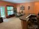 Cozy dining area featuring a built-in bar, large windows, and ample natural light at 878 Treasure Ct, Fort Mill, SC 29708