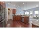 Eat-in kitchen with stainless appliances, granite counters and hardwood floors at 878 Treasure Ct, Fort Mill, SC 29708