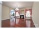 Open living area with hardwood floors, fireplace, and elegant window treatments at 878 Treasure Ct, Fort Mill, SC 29708
