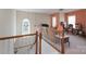 View from the stairs into the living area with carpet and natural light at 878 Treasure Ct, Fort Mill, SC 29708