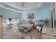 Tranquil main bedroom in light blue with coordinated décor and tray ceiling at 878 Treasure Ct, Fort Mill, SC 29708