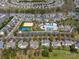 Aerial view of the community featuring pools, tennis courts, volleyball court, and clubhouse at 9727 Glenburn Ln, Charlotte, NC 28278
