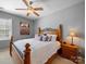Cozy bedroom featuring a wooden bed frame, soft lighting, and neutral wall colors at 9727 Glenburn Ln, Charlotte, NC 28278