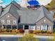 Aerial view of the clubhouse with stone facade and manicured landscaping at 9727 Glenburn Ln, Charlotte, NC 28278