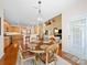 Inviting dining area featuring a round table with seating and chandelier, adjacent to a modern kitchen and living space at 9727 Glenburn Ln, Charlotte, NC 28278