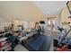 Spacious home gym with multiple exercise stations and a mirrored wall for monitoring at 9727 Glenburn Ln, Charlotte, NC 28278