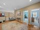 Upstairs landing featuring wood floors, a seating area, and doorways to rooms at 9727 Glenburn Ln, Charlotte, NC 28278