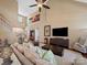 Spacious living room with high ceilings, a ceiling fan, and a large entertainment center at 9727 Glenburn Ln, Charlotte, NC 28278