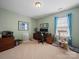 Comfortable office space with natural light, neutral carpet, and ample room for a desk at 9727 Glenburn Ln, Charlotte, NC 28278