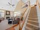 Elegant staircase leading to the second floor, with hardwood flooring and white railings at 9727 Glenburn Ln, Charlotte, NC 28278