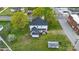 An aerial view shows a home with landscaping and a detached garage at 101 E Main St, Cleveland, NC 27013