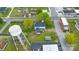 From above, a home is shown with outbuildings, mature trees, and a nearby water tower at 101 E Main St, Cleveland, NC 27013