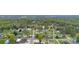 An aerial view shows homes with mature trees along a street, plus a water tower at 101 E Main St, Cleveland, NC 27013