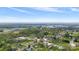 An aerial view showcases the town's layout, industrial area, and lush surrounding landscape at 101 E Main St, Cleveland, NC 27013