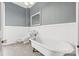 A bathroom featuring a large soaking tub, and traditional fixtures at 101 E Main St, Cleveland, NC 27013