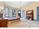 Bedroom featuring wallpaper and bright blue trim, with a bay window and a king bed at 101 E Main St, Cleveland, NC 27013