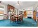 Dining room featuring a round wooden table and a brick fireplace at 101 E Main St, Cleveland, NC 27013