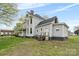 Well-maintained two-story home featuring updated siding, a back deck, and a spacious yard at 101 E Main St, Cleveland, NC 27013