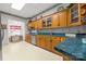 This kitchen features wooden cabinets, laminate countertops, and stainless steel appliances at 101 E Main St, Cleveland, NC 27013