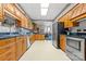 This kitchen features wooden cabinets, laminate countertops, stainless steel appliances, and neutral paint at 101 E Main St, Cleveland, NC 27013