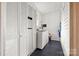 A laundry room with a washer, dryer and built-in storage at 101 E Main St, Cleveland, NC 27013