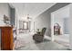 Inviting living room with a fireplace, a comfortable chair, and doorway views to the rest of the house at 101 E Main St, Cleveland, NC 27013