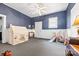 Spacious playroom with play tent, slide and swing set, and hardwood floors at 101 E Main St, Cleveland, NC 27013