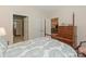 A bedroom featuring a four-poster bed with doorways leading to other rooms at 1018 Davant Ln, Charlotte, NC 28209