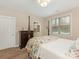A bedroom featuring a four-poster bed and access to a bathroom at 1018 Davant Ln, Charlotte, NC 28209