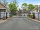 Gated community entrance with black iron gates provides security and exclusivity at 1018 Davant Ln, Charlotte, NC 28209