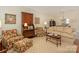 Inviting living room featuring a plush sofa, floral armchairs, and stylish decor, perfect for relaxation at 1018 Davant Ln, Charlotte, NC 28209