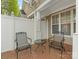 Cozy brick patio area with wrought iron seating, offering a relaxing outdoor space at 1018 Davant Ln, Charlotte, NC 28209