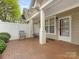Outdoor brick patio has space for seating and entertaining with direct access to the house at 1018 Davant Ln, Charlotte, NC 28209