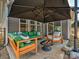 Backyard patio with seating area and umbrella at 104 Hemlock Cove Ct, Mooresville, NC 28117