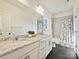 This bathroom has a dual sink vanity, granite countertop, and a shower and tub combo at 104 Hemlock Cove Ct, Mooresville, NC 28117