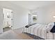 Cozy bedroom featuring a queen bed and an ensuite bathroom at 104 Hemlock Cove Ct, Mooresville, NC 28117