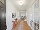 Inviting entryway with wood floors, charming decor, and elegant French doors, creating a warm welcome at 104 Hemlock Cove Ct, Mooresville, NC 28117