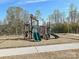 A playground area with slides and climbing frames at 104 Hemlock Cove Ct, Mooresville, NC 28117