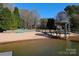 Scenic lake beach and gazebo with seating, ideal for waterfront relaxation at 105 Beach Ln, Mooresville, NC 28117
