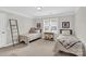 Spacious bedroom with two twin beds, natural light, and cozy decor at 105 Beach Ln, Mooresville, NC 28117