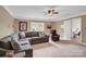 Comfortable bonus room boasts plush seating, soft carpet, and natural light at 105 Beach Ln, Mooresville, NC 28117