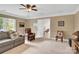 Cozy bonus room features neutral paint, ceiling fan, and comfortable seating at 105 Beach Ln, Mooresville, NC 28117