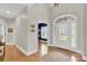 Elegant foyer showcasing hardwood floors, arched doorway, and bright, welcoming space at 105 Beach Ln, Mooresville, NC 28117