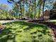 Large front yard with mature trees and landscaping at 105 Beach Ln, Mooresville, NC 28117