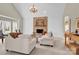 Cozy living room featuring a stone fireplace, neutral tones, and comfortable seating area at 105 Beach Ln, Mooresville, NC 28117
